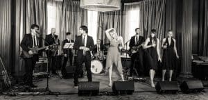 Side One band performing