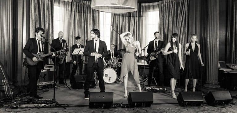 Side One band performing