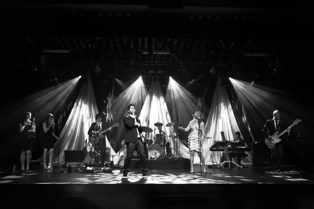 Side One band performing