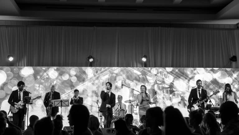 Side One band singers singing